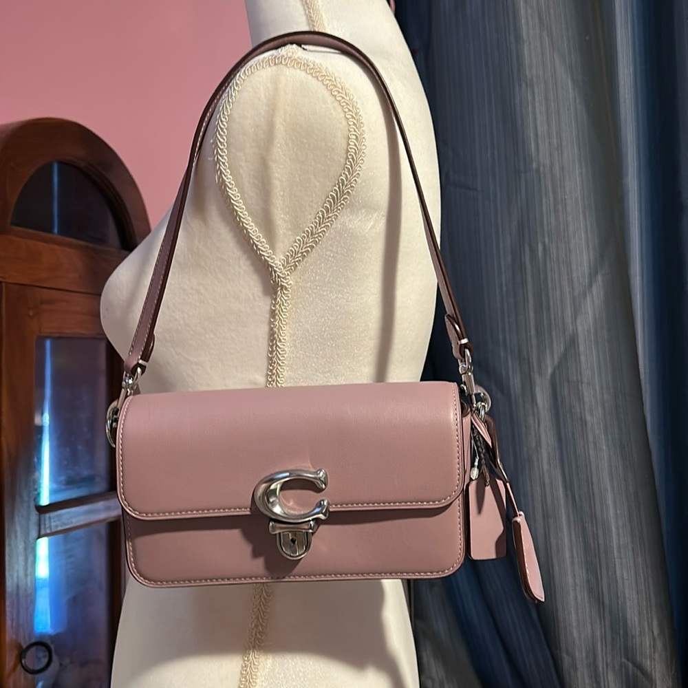 Never wore. Still has the plastic tag. comes with a longer strap also
